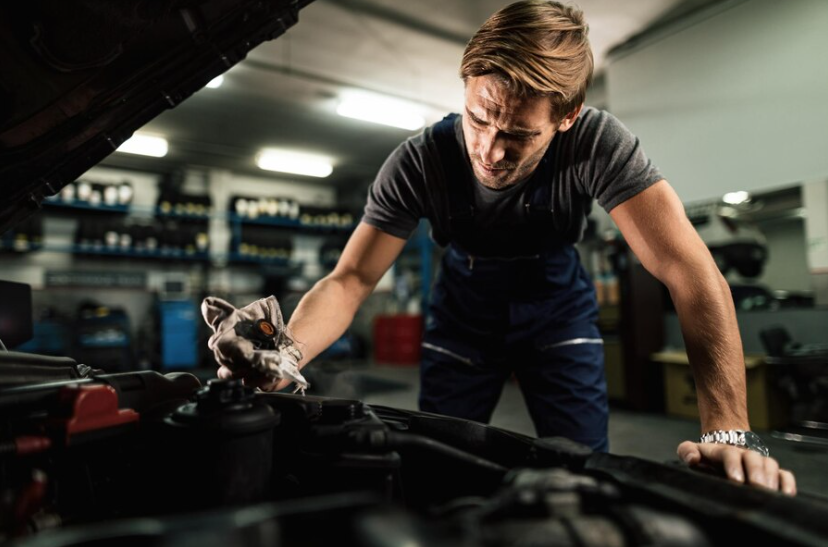 Mechanic working on car for better engine performance